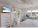 Serene bedroom features a canopy bed, desk, and balcony access at 7000 Gulf Dr # 205, Holmes Beach, FL 34217
