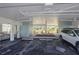 Covered parking area with car, offering convenient and protected parking spaces for residents at 7000 Gulf Dr # 205, Holmes Beach, FL 34217