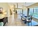 Cozy dining area with a chandelier and a view of the outdoor scenery at 7330 Kensington Ct, University Park, FL 34201