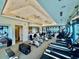 Modern gym with a variety of exercise equipment including treadmills and stationary bikes at 7330 Kensington Ct, University Park, FL 34201