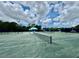 Well-maintained community tennis court with professional surfacing and lighting at 7330 Kensington Ct, University Park, FL 34201