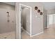 Bathroom with walk-in shower, toilet room, and beige tile flooring at 7626 Double Pine Dr, Sarasota, FL 34240