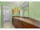 Bright bathroom with double vanity, colorful decor, and tile flooring at 7626 Double Pine Dr, Sarasota, FL 34240