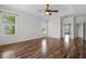 Spacious bedroom with ceiling fan, wood floors, and lots of natural light at 7626 Double Pine Dr, Sarasota, FL 34240