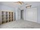 Neutral bedroom with large closet and shelving for organization at 7626 Double Pine Dr, Sarasota, FL 34240