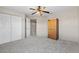 Bedroom with large closet, wooden armoire and neutral carpeting at 7626 Double Pine Dr, Sarasota, FL 34240