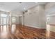 Spacious living room with hardwood floors, neutral walls, and plenty of natural light at 7626 Double Pine Dr, Sarasota, FL 34240