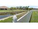 This property features water views beyond the fence and landscaping at 7626 Double Pine Dr, Sarasota, FL 34240