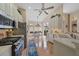 Open-concept kitchen features modern appliances and breakfast nook with views of the outdoors at 7821 Troon Ct, Lakewood Ranch, FL 34202