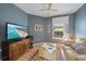 Comfortable living room with a large flat-screen TV and plush leather seating at 7821 Troon Ct, Lakewood Ranch, FL 34202