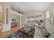 Bright living room with vaulted ceiling and large window overlooking the backyard at 7821 Troon Ct, Lakewood Ranch, FL 34202