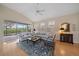 Open living room with hardwood floors, and view of screened patio at 7821 Troon Ct, Lakewood Ranch, FL 34202