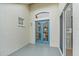 Enclosed patio with blue French doors and arched window for natural lighting at 7821 Troon Ct, Lakewood Ranch, FL 34202