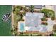 Aerial view showcasing a home with a pool and boat dock, blending luxury and waterfront living at 878 Freeling Dr, Sarasota, FL 34242