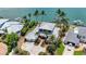 Stunning aerial view of a luxurious home boasting lush landscaping, and convenient boat access at 878 Freeling Dr, Sarasota, FL 34242