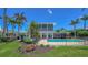 Stunning two-story home featuring a private pool, screened enclosure, and beautifully landscaped backyard oasis at 878 Freeling Dr, Sarasota, FL 34242