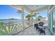 Balcony with water views, seating area, and classic white railing to enjoy the outdoors at 878 Freeling Dr, Sarasota, FL 34242