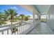 Screened balcony showcasing palm tree views and beautiful architectural elements at 878 Freeling Dr, Sarasota, FL 34242