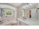 Bright bathroom featuring shower over tub, and white vanity at 878 Freeling Dr, Sarasota, FL 34242