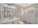Bathroom featuring large mirror, shower with glass door, and white vanity at 878 Freeling Dr, Sarasota, FL 34242