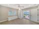 Bedroom features wood floors, natural light, and access to outdoor patio through sliding glass door at 878 Freeling Dr, Sarasota, FL 34242