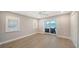 Airy bedroom with windows and a door to outdoor patio at 878 Freeling Dr, Sarasota, FL 34242