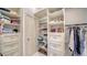 Walk-in closet with custom shelves, drawers, and hanging rods to maximize storage space at 878 Freeling Dr, Sarasota, FL 34242
