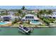This waterfront home boasts a private boat lift, pool, and beautiful landscaping, ideal for the boating enthusiast at 878 Freeling Dr, Sarasota, FL 34242