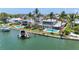 Luxury waterfront home with tropical landscaping, pool, and private boat dock offering coastal living at its finest at 878 Freeling Dr, Sarasota, FL 34242