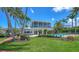 Captivating two-story home with a pool, screened enclosure, and meticulously landscaped yard at 878 Freeling Dr, Sarasota, FL 34242