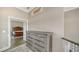 Hallway with grey dresser and view of bedroom at 878 Freeling Dr, Sarasota, FL 34242