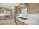 Modern kitchen with stainless steel appliances, gas range, custom cabinetry, and light wood flooring at 878 Freeling Dr, Sarasota, FL 34242