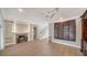 Cozy living room features a fireplace, hardwood floors, and staircase access at 878 Freeling Dr, Sarasota, FL 34242
