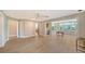 Open living area with hardwood floors, recessed lighting, and views to outdoor pool area at 878 Freeling Dr, Sarasota, FL 34242