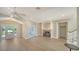 Bright living room with fireplace, hardwood floors, and french doors to the outdoors at 878 Freeling Dr, Sarasota, FL 34242