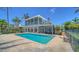 Enjoy the outdoor pool and patio with stunning views of the home's architecture at 878 Freeling Dr, Sarasota, FL 34242
