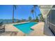 Private backyard pool and dock with boat lift offer the ultimate waterfront lifestyle at 878 Freeling Dr, Sarasota, FL 34242