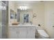 Bright bathroom with white cabinets, quartz countertops, and updated fixtures at 910 Tidewater Shores Loop # 103, Bradenton, FL 34208