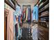 Walk-in closet features custom shelving and ample hanging space for organized storage at 910 Tidewater Shores Loop # 103, Bradenton, FL 34208