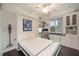 Murphy bed down in this versatile room with custom built-ins, desk, and lots of storage space at 910 Tidewater Shores Loop # 103, Bradenton, FL 34208