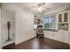 Versatile room with custom built-ins, desk, and Murphy bed for flexible living at 910 Tidewater Shores Loop # 103, Bradenton, FL 34208