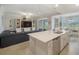 The kitchen has stainless appliances, a breakfast nook, and is open to the living room at 910 Tidewater Shores Loop # 103, Bradenton, FL 34208