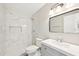 Modern bathroom with a marble-tiled shower, updated fixtures, and a sleek vanity for a spa-like feel at 920 Myrtle Ave, Venice, FL 34285