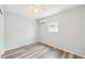 Cozy bedroom featuring durable laminate flooring, light gray walls, and a ceiling fan at 920 Myrtle Ave, Venice, FL 34285