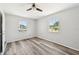 Large bedroom with abundant natural light and wood-style flooring at 920 Myrtle Ave, Venice, FL 34285