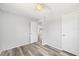 Neutral bedroom showcasing vinyl floors, a ceiling fan, and closet space at 920 Myrtle Ave, Venice, FL 34285