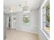 Bright eat-in kitchen with views of the backyard pool, a hanging light fixture, and white walls at 920 Myrtle Ave, Venice, FL 34285