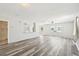 Spacious living room with sleek flooring and ample natural light from large windows at 920 Myrtle Ave, Venice, FL 34285