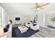 Inviting living room with modern furniture and a TV, perfect for relaxation at 920 Myrtle Ave, Venice, FL 34285