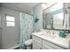 Bathroom features a stand-up shower, nautical decor, and a classic white vanity sink at 102 & 104 48Th St, Holmes Beach, FL 34217